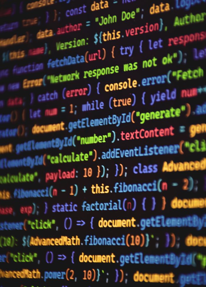 gallery-4 Close-up of vibrant colored JavaScript code showing functions and syntax on a dark screen.